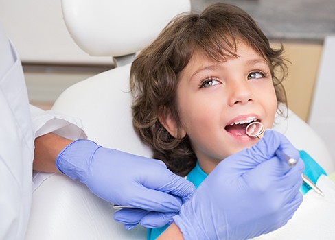 Child receiving dental exam