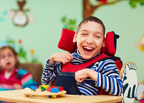 Laughing child in wheelchair