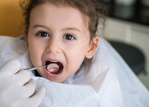 Young child receiving dental treatment
