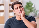 Man holding jaw