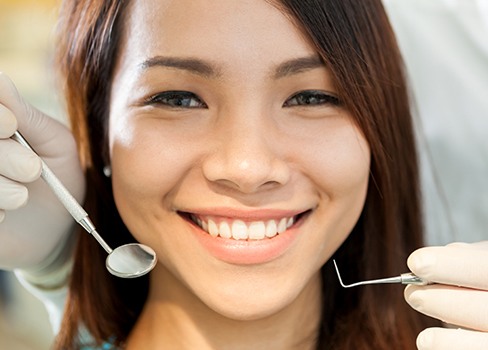 Woman receiving dental checkup