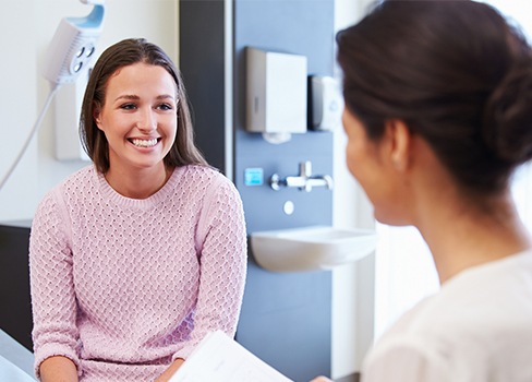 Woman in dental chair smiling