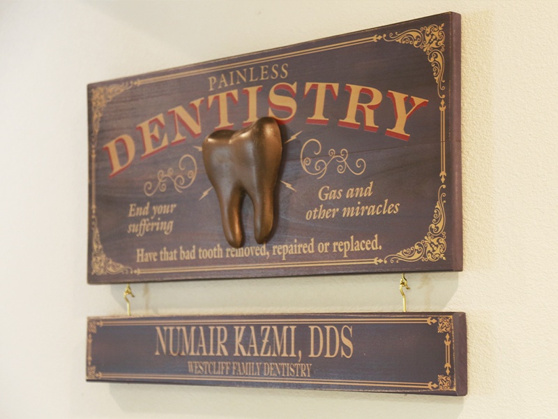Painless Dentistry sign on dental office wall