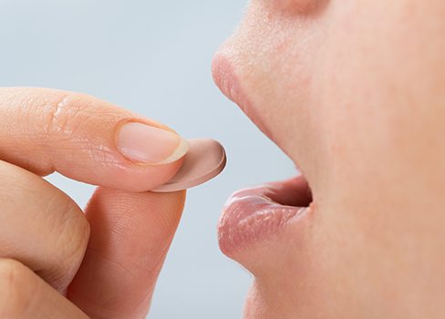 Patient taking oral sedative pill