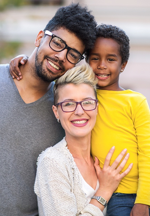 Smiling mother father and child